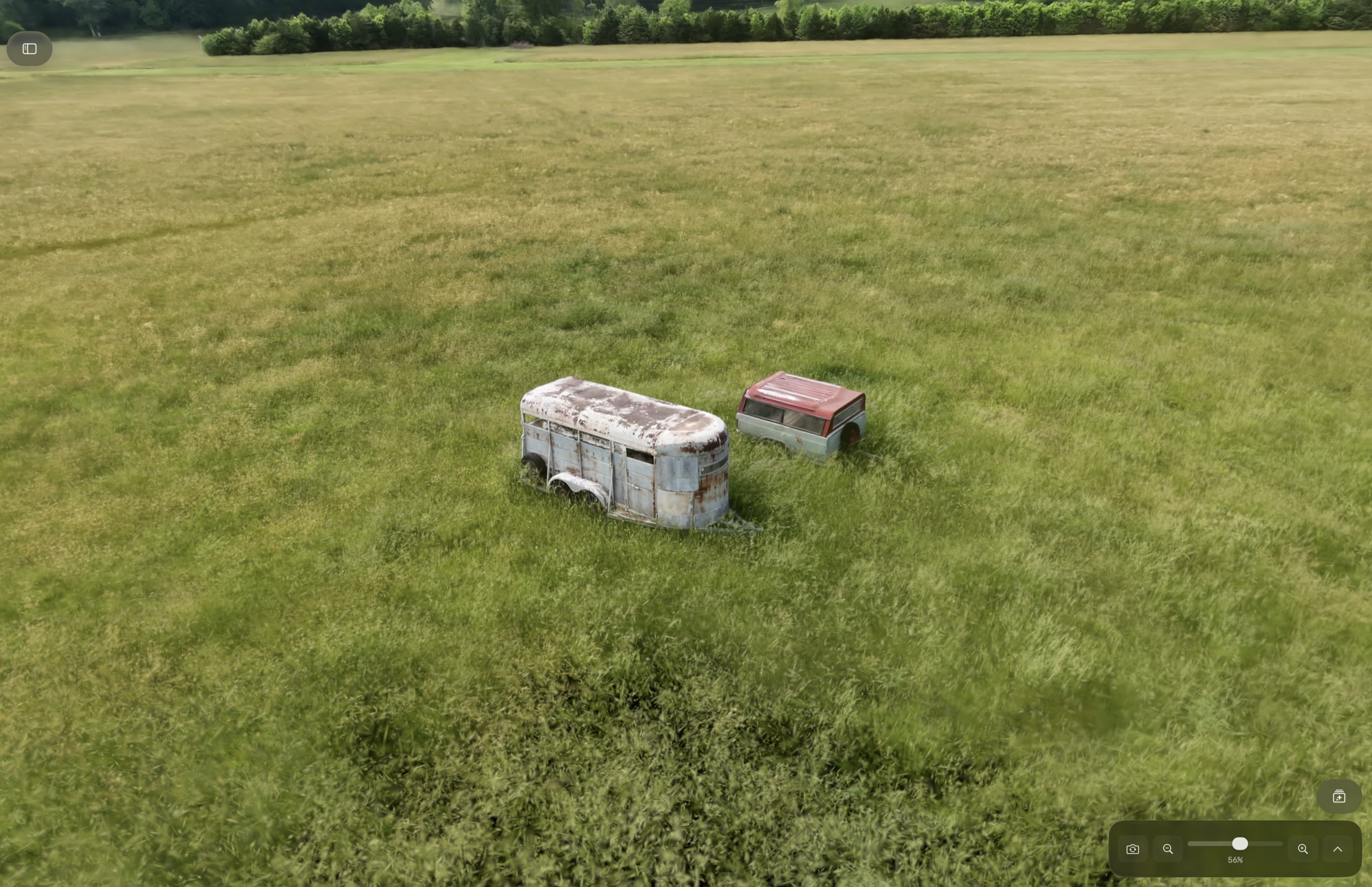A Gaussian splat scene rendered full screen over a grassy field